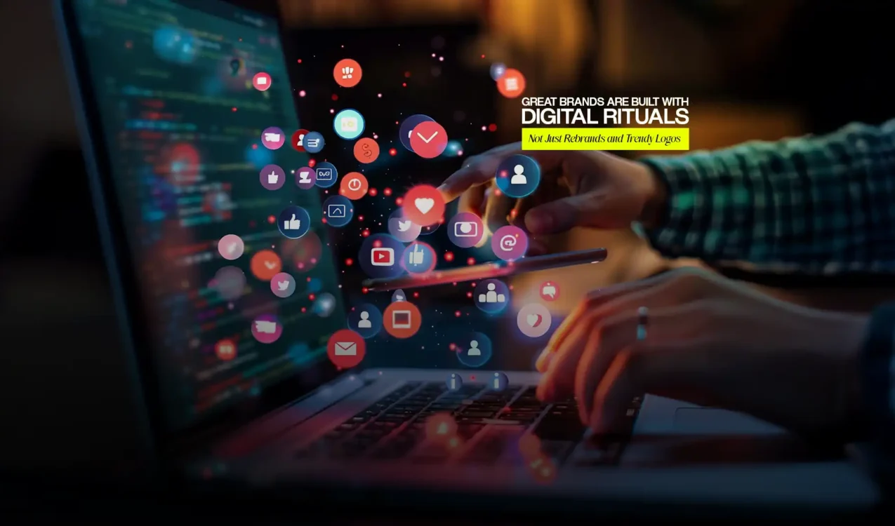 Hands using laptop surrounded by floating social media icons created by the Best Digital Brand Building Agency in India