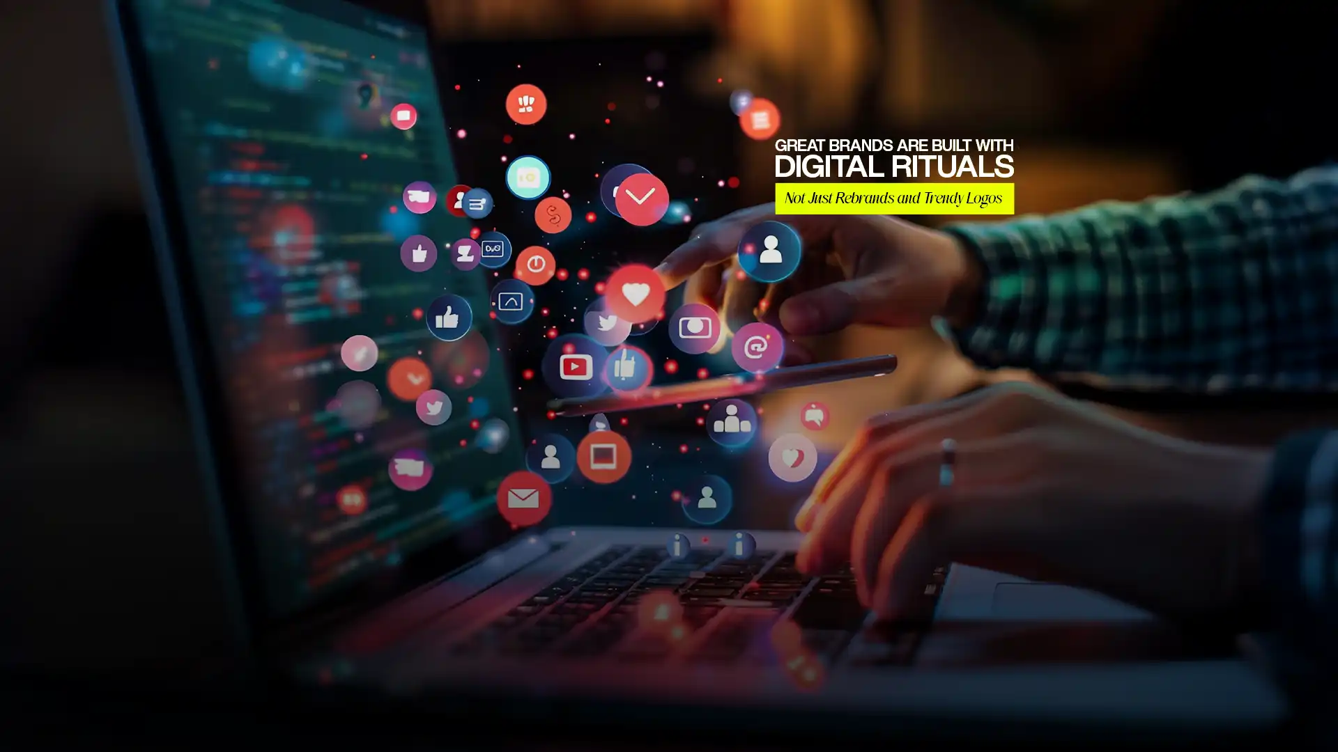 Hands using laptop surrounded by floating social media icons created by the Best Digital Brand Building Agency in India